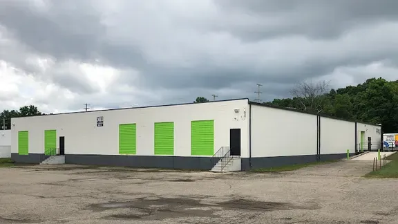 Kalamazoo outside of building with lime green doors